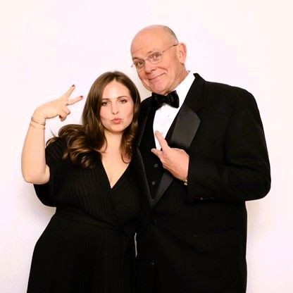 Father and Daughter posing for photo